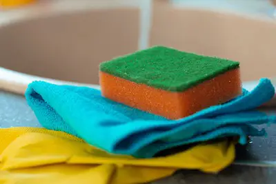 Cleaning sponge and rag on kitchen counter